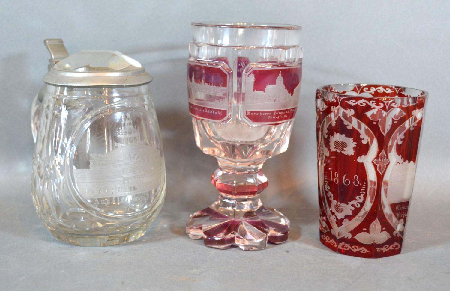 A Bohemian Ruby Glass Beaker together with a similar Goblet and a clear glass lidded Tankard