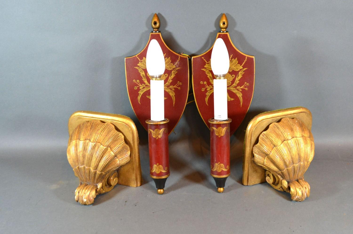 A Pair of Red Tole Ware Wall Lights, the shield back with gilt decoration and single light fitting