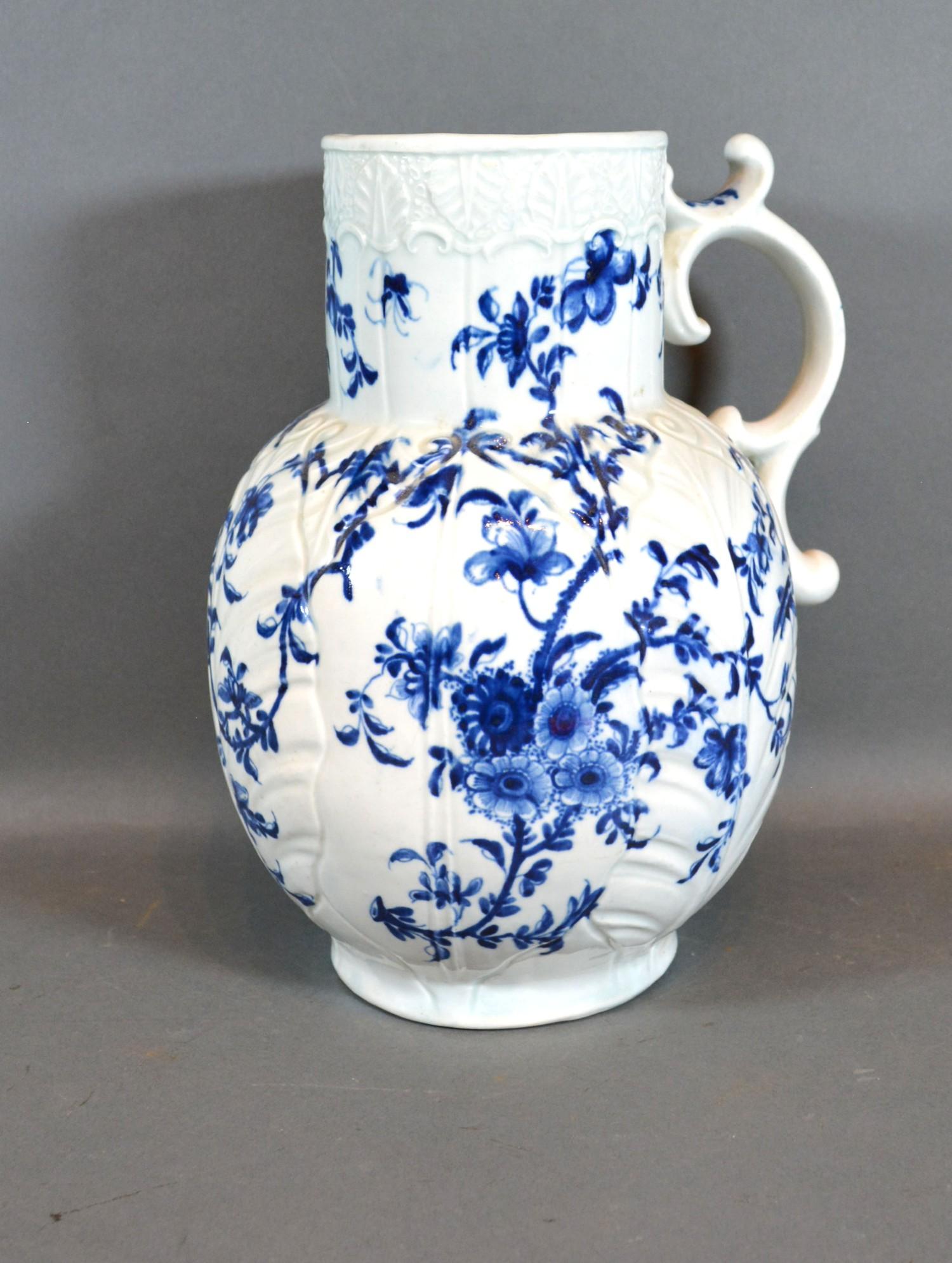 An 18th Century English Large Jug decorated in underglaze blue with birds amongst foliage, 26 cms