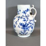 An 18th Century English Large Jug decorated in underglaze blue with birds amongst foliage, 26 cms