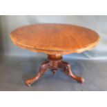A Victorian Mahogany Centre Table, the circular top above a shaped frieze raised upon a bulbous