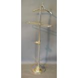 A Chromium Plated Valet Stand with hanger, rail and dish upon circular base 143cm tall