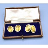 A Pair of 18ct. Gold and Enamel Decorated Cufflinks within original fitted box, 9.8 gms.