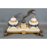 A French Style Ormolu, Bronze and Marble Ink Stand with winged figure and raised upon griffin