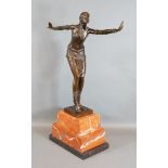 An Art Deco style Patinated Bronze Figure in the form of a dancing girl after Chiparus upon