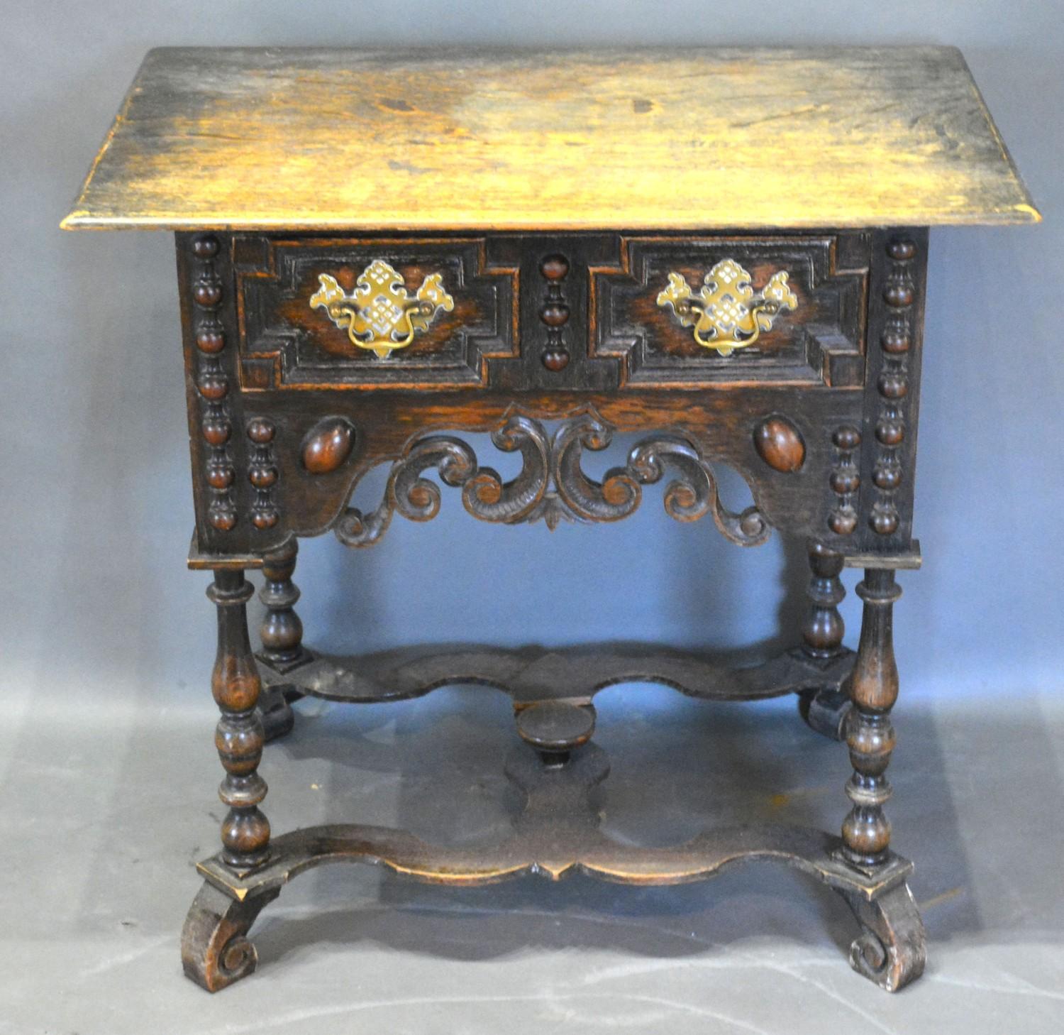 A Jacobean Style Oak Low Boy, the geometric moulded and pierced front with a frieze drawer and brass - Image 2 of 2