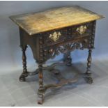 A Jacobean Style Oak Low Boy, the geometric moulded and pierced front with a frieze drawer and brass