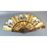 A 19th Century Fan with Hand Painted Paper Leaf depicting figures, the shaped wooden guards and