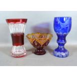 A Bohemian Blue Glass Goblet, 20 cms tall together with a Ruby Glass Vase and a similar pedestal