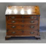 A 19th Century Mahogany Bureau, the fall front enclosing a fitted interior above long drawers with