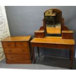A Victorian Mahogany Dressing Table with a swing mirror and four jewel drawers above two drawers