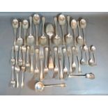 An Edwardian Canteen of Cutlery by Atkin Brothers comprising spoons, forks, basting spoon, caddy