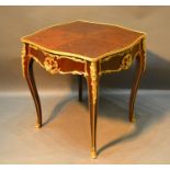 A French Marquetry Inlaid and Gilt Metal Mounted Centre Table with a shaped frieze raised upon