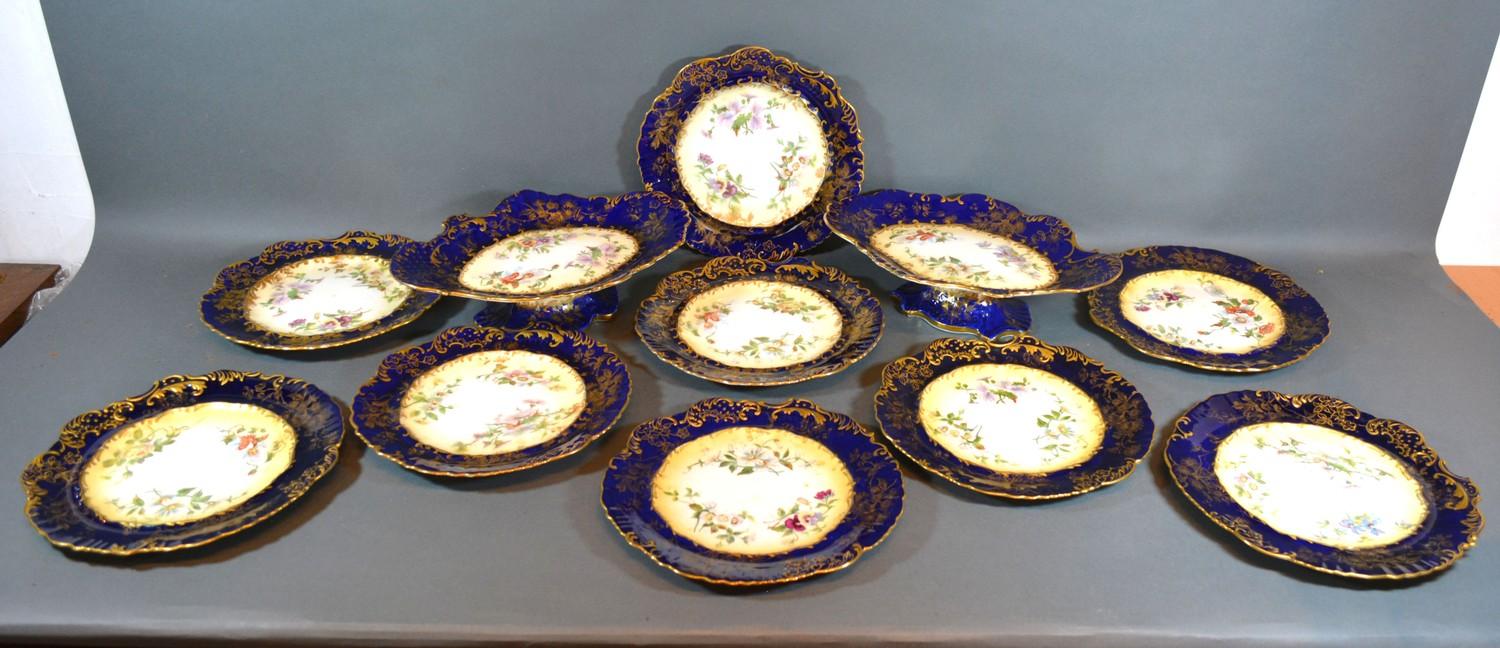 A Hammersley Dessert Service comprising a pair of comports and nine plates all hand painted with