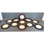 A Hammersley Dessert Service comprising a pair of comports and nine plates all hand painted with