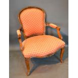 A French Drawing Room Armchair with a Shaped Upholstered Back and Seat with Scroll Arms raised