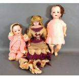A 19th Century Wax Doll together with a German Bisque Head Doll by Heubach Koppelsdorf and another
