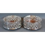 A Pair of Silver Plated and Turned Wooden Bottle Coasters of pierced form 12cm diameter