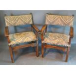 A Pair Of Late 18th or Early 19th Century Continental Oak Armchairs, each with an upholstered back