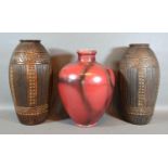 A Pair of Bretby Pottery Vases of oviform with ribbed decoration, 28 cms tall, together with a
