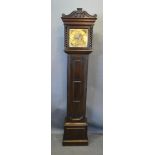 An Oak Longcase Clock, the square hood with barley twist columns and shaped cresting above a moulded