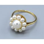 A 14 ct. Gold Pearl Cluster Ring by Mikimoto, 3.2 gms. ring size Q
