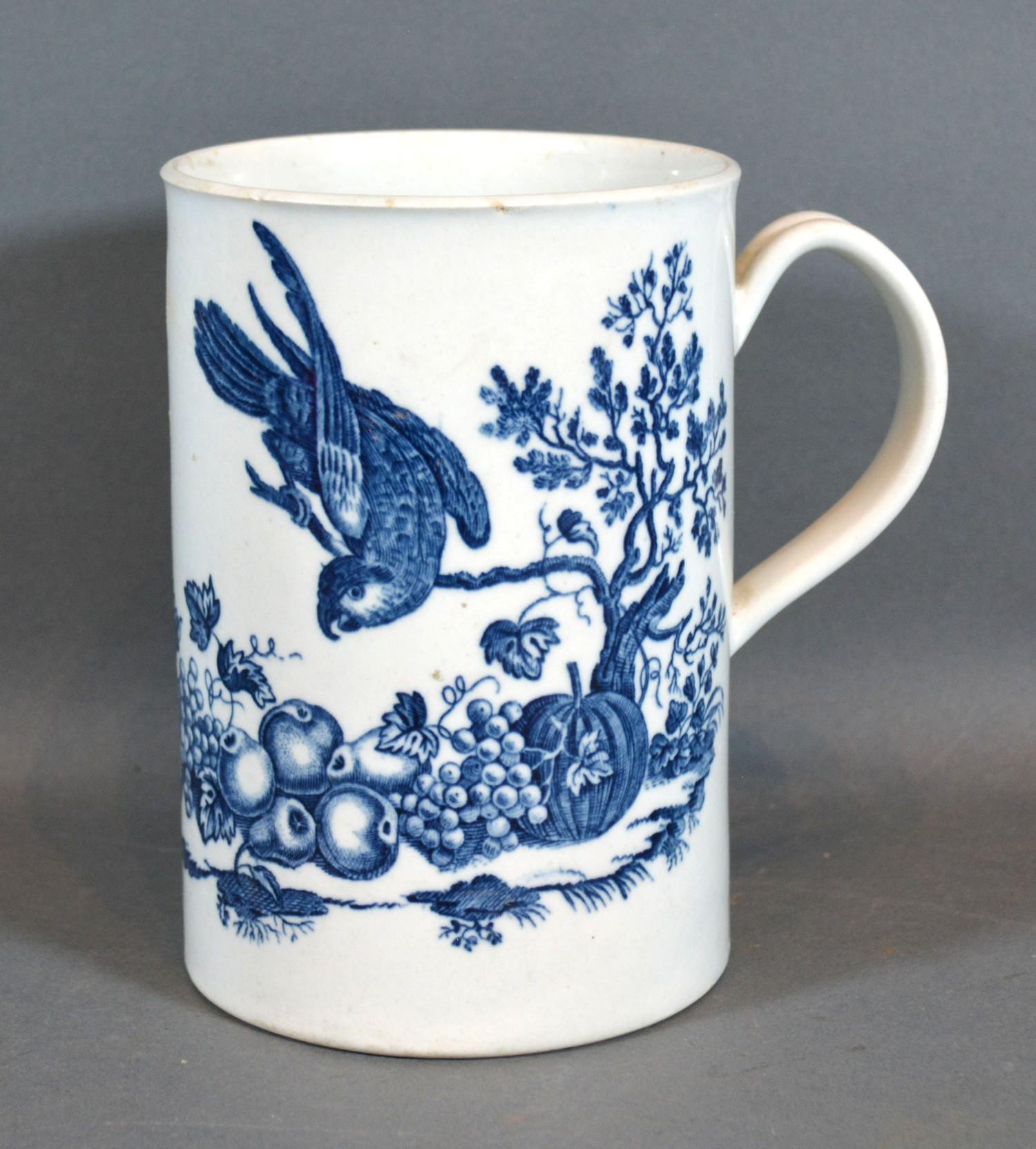 A First Period Worcester Large Mug decorated in underglaze blue with birds and insects amongst fruit