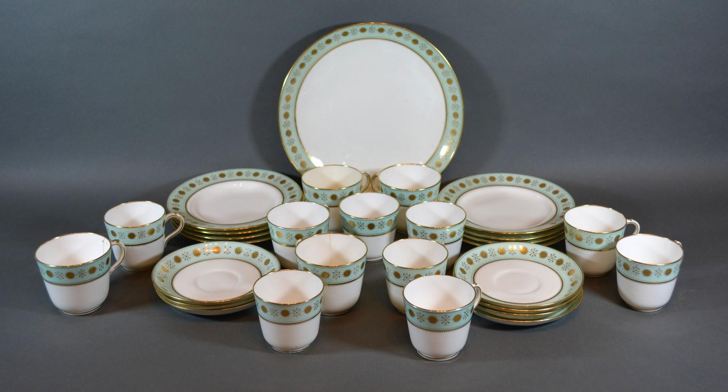 A Mintons Tea and Coffee Service comprising cups, saucers and plates all with a gilt decoration upon