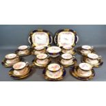 A Hammersley Porcelain Tea Service comprising eleven cups, ten saucers, eleven plates, two serving