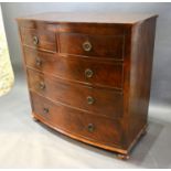 A 19th Century Mahogany Bow Fronted Chest of two short and three long drawers with circular brass