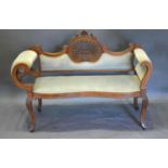 An Edwardian Mahogany Line Inlaid Drawing Room Sofa, the shaped pierced and upholstered back above a