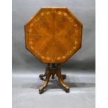 A Victorian Walnut Marquetry Inlaid Centre Table, the octagonal top above quadruple turned reeded