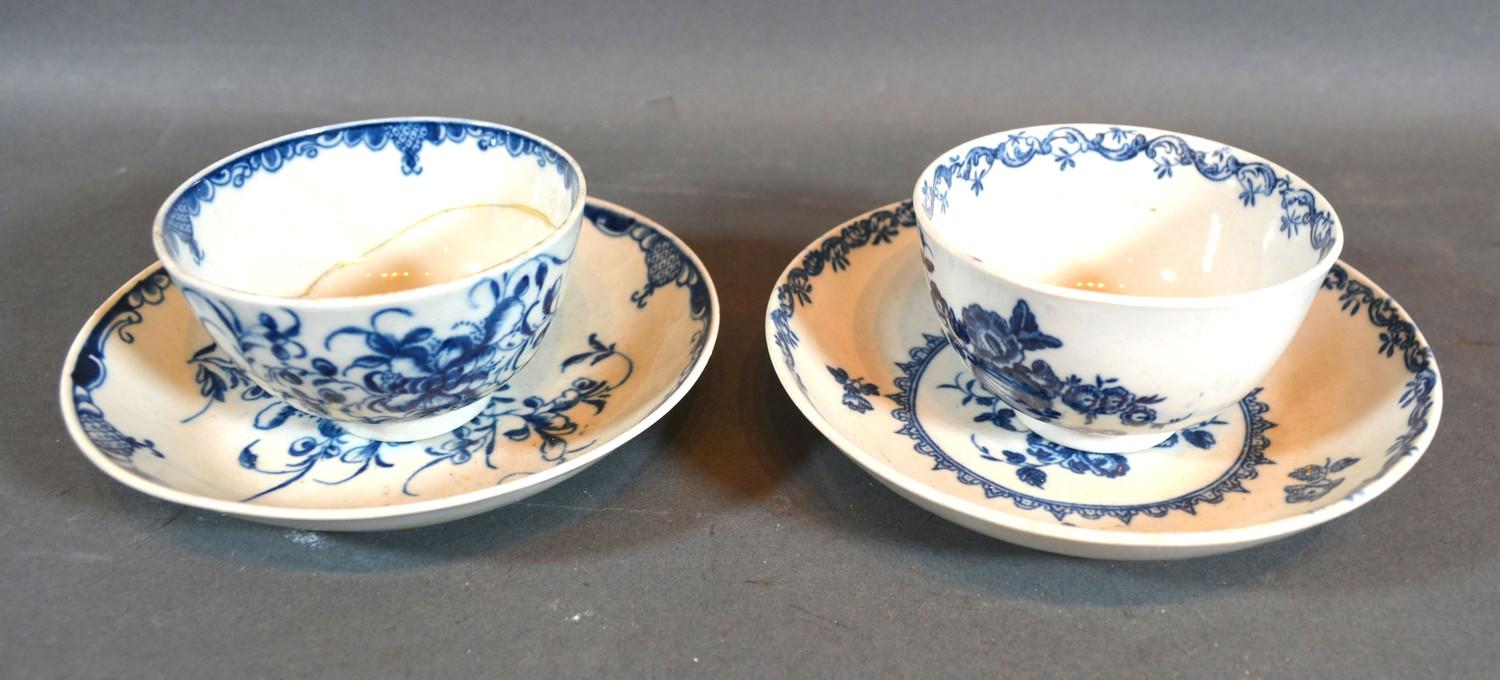 A First Period Worcester Tea Bowl with Saucer decorated in underglaze blue together with another