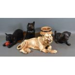 A Bretby Pottery Model in the form of a Tiger together with two similar Bretby models of Cats,