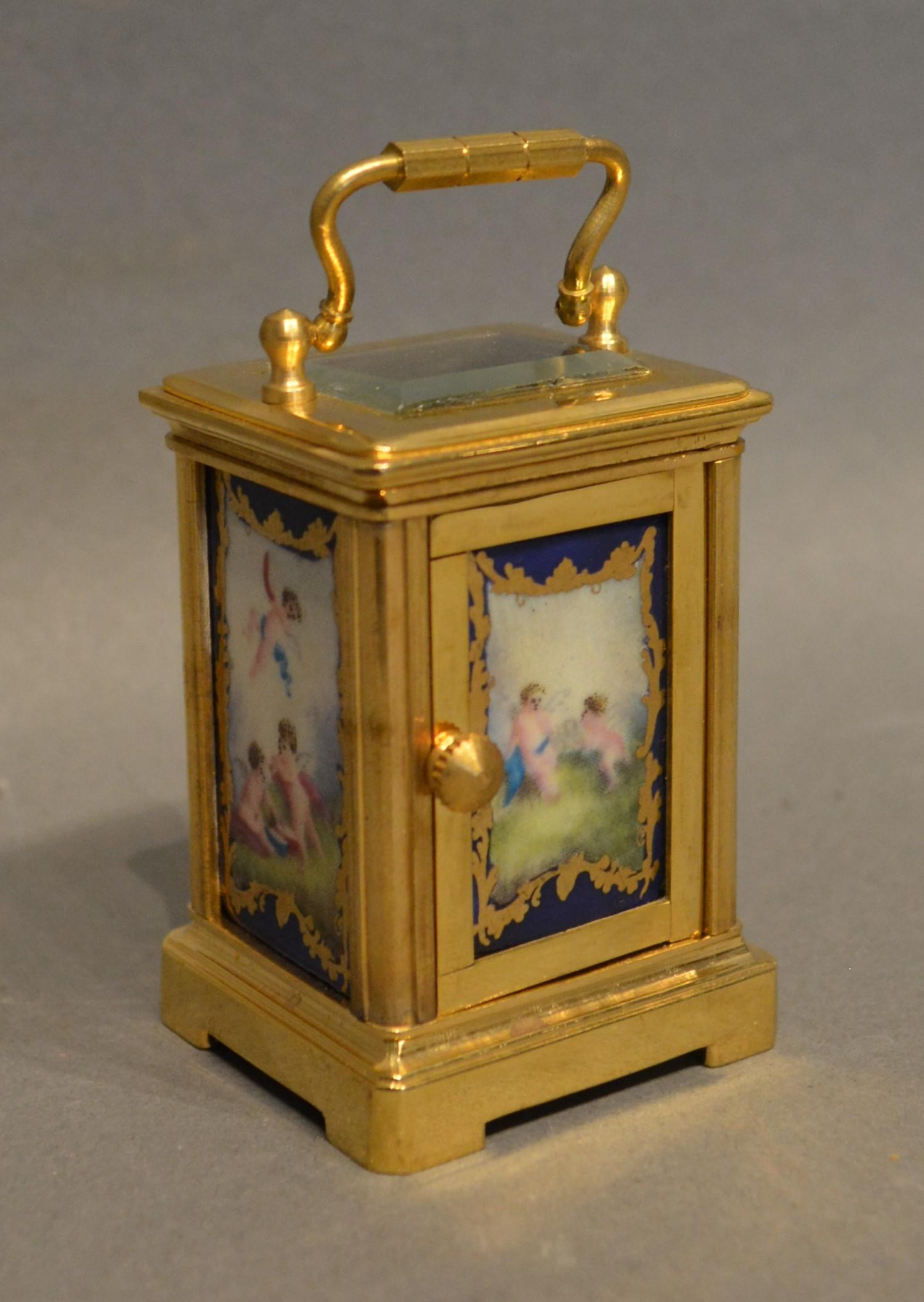 A Miniature Brass Cased Carriage Clock the silvered dial with roman numerals and with painted - Image 2 of 2