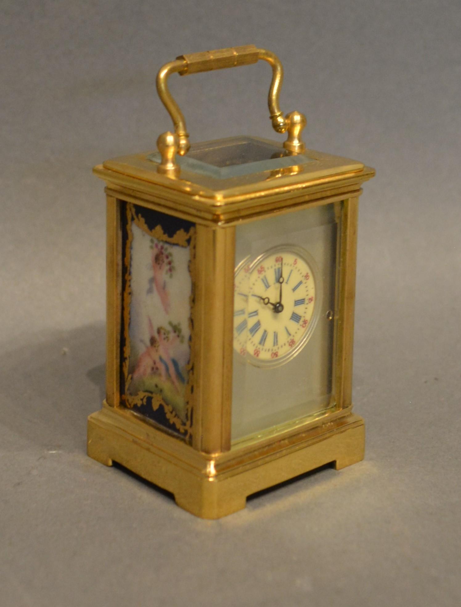 A Miniature Brass Cased Carriage Clock the silvered dial with roman numerals and with painted