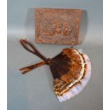 A Bakelite Box, decorated in relief with figures dancing together with a small feather fan