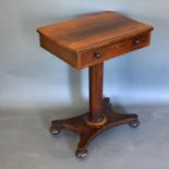 A Victorian Rosewood Work Table with a fitted frieze drawer raised upon an octagonal centre