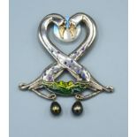 An 18ct. White Gold Pendant in the form of two swans set with diamonds, sapphires and amethysts with