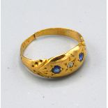 An 18ct. Gold Diamond and Sapphire Gypsy Ring, 1.9 gms. ring size H