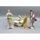 A Berlin Porcelain Double Salt with putti surmount together with three German porcelain figures
