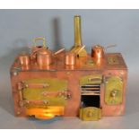 A Miniature Copper and Brass Victorian Style Range with miniature copper saucepans and kettle