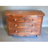 A Victorian Mahogany Bow Fronted Chest of Drawers, the moulded top above two short and two long