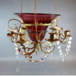 A Cranberry Glass Chandelier with Facet Cut Glass Drops and Candle Sconces, 40 cms diameter