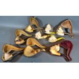 A collection of nine Meerschaum Pipes, some with original cases