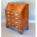 A 19th Century Mahogany Bureau, the fall front enclosing a fitted interior above four long drawers