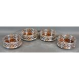 A Set of Four Silver Plated and Turned Wooden Bottle Coasters of pierced form 12.5cm diameter