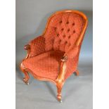 A Victorian Mahogany Drawing Room Armchair, the button upholstered back above a serpentine stuff