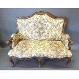 A Late 19th Early 20th Century French Salon Sofa, the shaped back above a similar seat with scroll