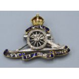 An 18ct. Gold Royal Artillery Brooch set with blue enamel and diamonds, 9.9 gms.